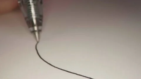 Drawing a line on a white paper in close-up 库存影片 154191722