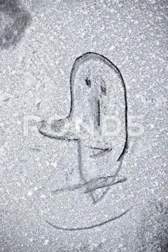 Drawing Man Face On Snow