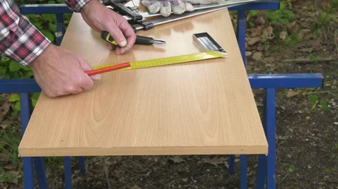 Drawing a melamine panel with a square and a pencil Stock Footage 63506254