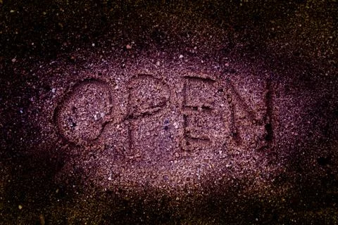 Drawing open on sand background Stock Photos