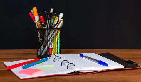 Drawing pad on the table with colored pencils on the table. Stock Photos