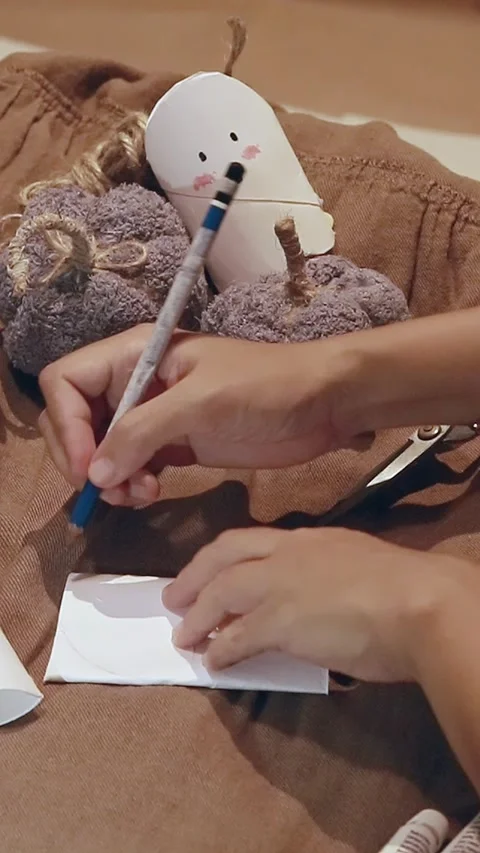 Drawing a pattern on a recycled paper towel roll  Stock Footage 288717413