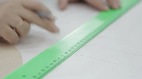 Drawing with a pencil and ruler. mark on paper. Stock Footage 60761921