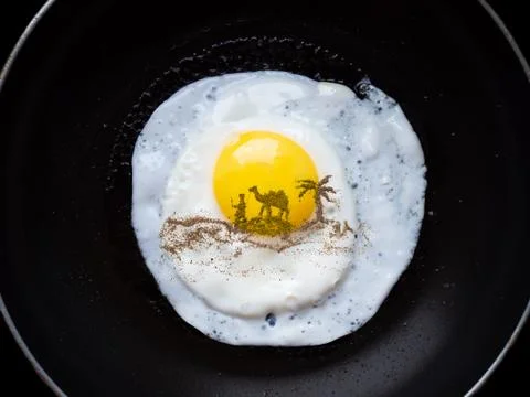 Drawing pepper on an omelette Stock Photos