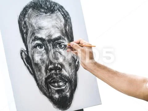 Drawing portrait of asian man with black ink on canvas Stock Photos