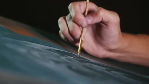 The drawing process, close-up of the artist hand drawings with a brush on the Stock Footage 144752112