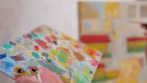 Drawing process, girl hand hold palette and painting paint on canvas Stock Footage 239262519