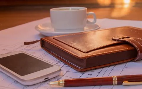 Drawing, project, coffee Cup mobile phone diary closeup selective focus Stock Photos