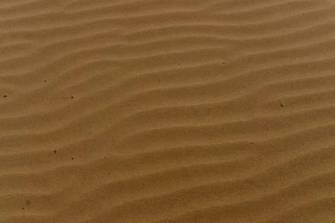 Drawing on the sand after the waves Stock Photos
