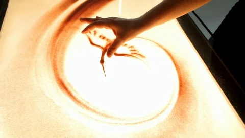 Drawing with sand. Drawing sand on a screen. Sand Artist. Hands draws. Animation Stock Footage 89714881