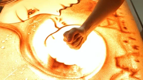 Drawing with sand. Drawing sand on a screen. Sand Artist. Hands draws. Animation Stock Footage 89715241