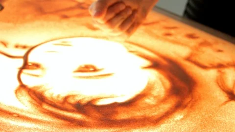 Drawing with sand. Drawing sand on a screen. Sand Artist. Hands draws. Animation Stock Footage 89715392