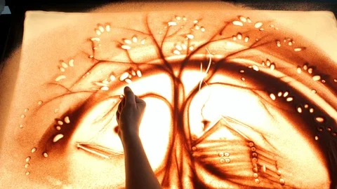 Drawing with sand. Drawing sand on a screen. Sand Artist. Hands draws. Animation Stock Footage 89715741