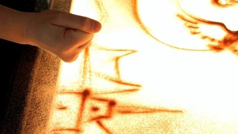 Drawing with sand. Drawing sand on a screen. Sand Artist. Hands draws. Animation Stock Footage 89754244