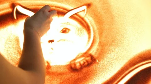 Drawing with sand. Drawing sand on a screen. Sand Artist. Hands draws. Animation Stock Footage 89755512