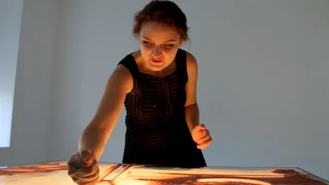 Drawing with sand. Drawing sand on a screen. Sand Artist. Hands draws. Animation Stock Footage 89832662