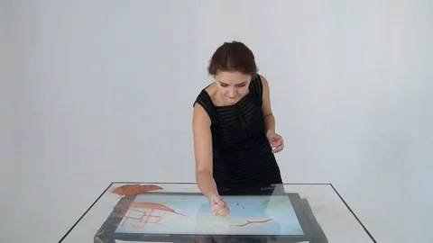 Drawing with sand. Drawing sand on a screen. Sand Artist. Hands draws. Animation Stock Footage 89956348