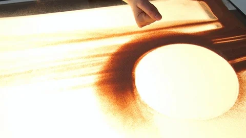 Drawing with sand. Drawing sand on a white screen. Sand Artist. Hands draws Stock Footage 89653261