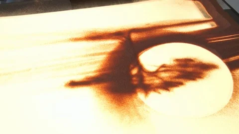 Drawing with sand. Drawing sand on a white screen. Sand Artist. Hands draws Stock Footage 89686613
