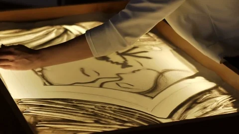 Drawing with sand on glass Stock Footage 69945460
