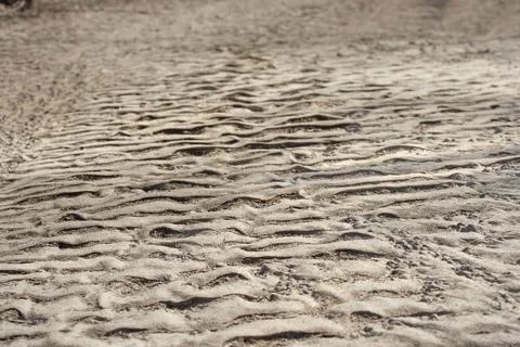Drawing on a sandy beach at sunset, pattern , texture, background Stock Photos
