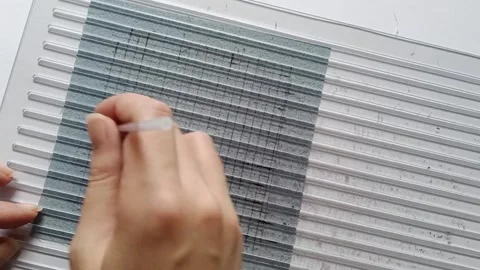 Drawing Sashiko Guide Lines with a Calligraphy Ruler.  Stock-Footage 344923433