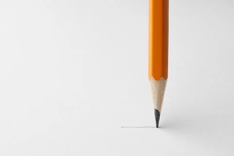 Drawing with sharp graphite pencil on white sheet of paper, closeup. Space .. Foto stock