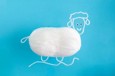Drawing of sheep from wool threads with ball integrated knitting creative Stock Photos