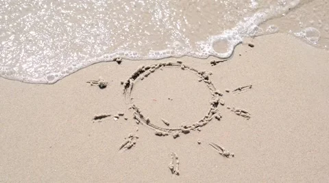 Drawing sun on the seashore Stock Footage 66243702