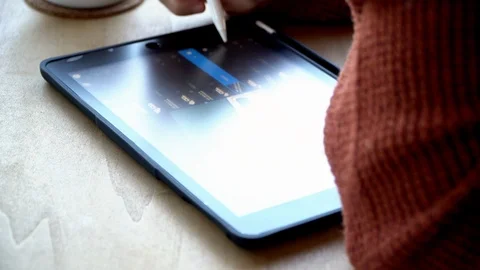 Drawing on a tablet with pencil Stock Footage 123313494