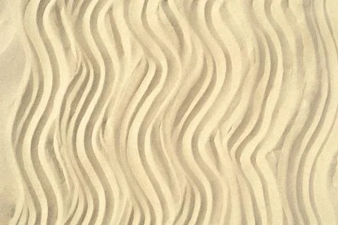 Drawing of waves on the sand on the beach, sand pattern Stock Photos