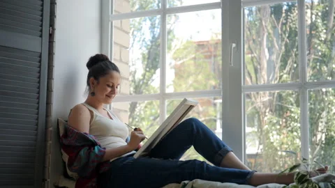 Drawing by the window Stock Footage 89327798