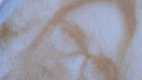 Drawing of a woman's face on a foam coffee latte Stock Footage 103525768