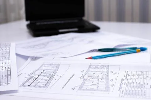 Drawings of a construction engineer on a sheet of paper Stock Photos