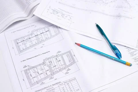 Drawings of a construction engineer on a sheet of paper Stock Photos