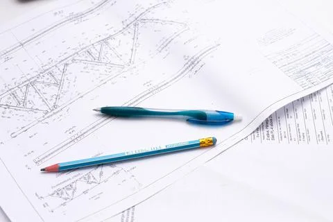 Drawings of a construction engineer on a sheet of paper Stock Photos