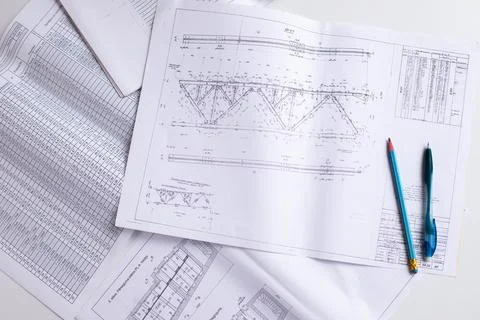 Drawings of a construction engineer on a sheet of paper Stock Photos