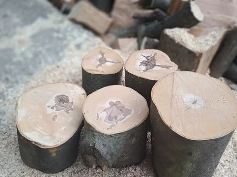 Drawings on firewood Stock Photos