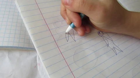 Drawings of men with pen Stock Footage 129101100