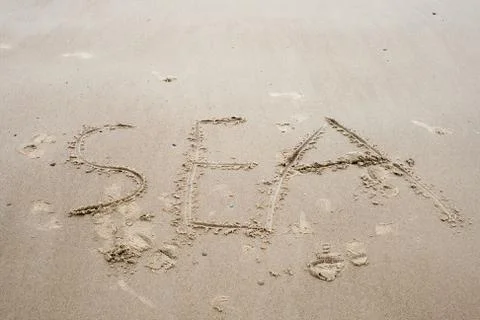 Drawings in the sand on beach Stock Photos