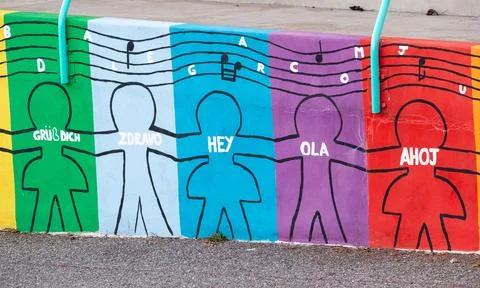 Drawings on the wall of children saying hello Stock Photos