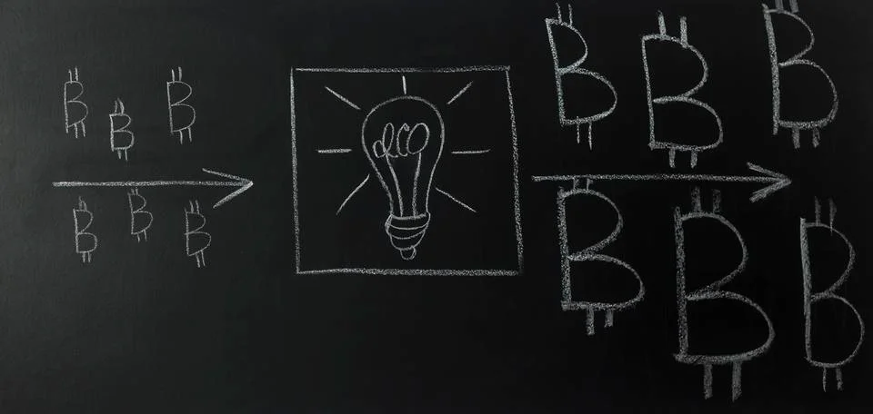 Drawn light bulb inside the text - idea, with logo bitcoin on blackboard. Stock Photos