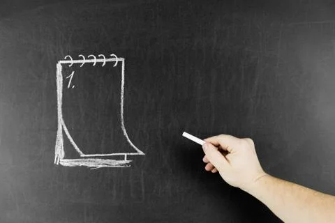 Drawn notepad on blackboard and chalk Stock Photos