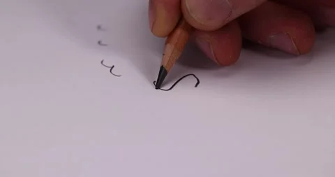 Drawn on old white paper with a black graphite pencil, a primitive pencil Stock Footage 321129547