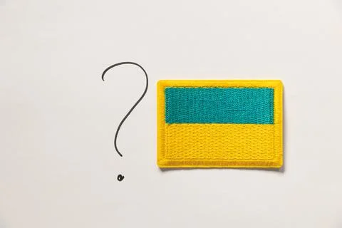 Drawn question mark and flag of Ukraine on white background Stock Photos