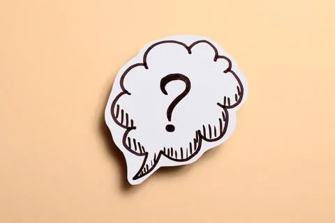 Drawn question mark over beige background Stock Photos