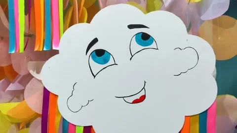 Drawn white cloud with blue eyes and red smile Stock Footage 145730610
