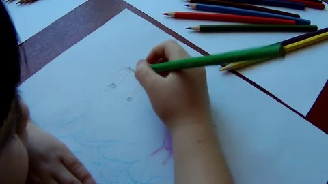 Draws a child with pencils Stock Footage
