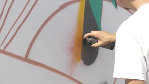 Draws graffiti paint from the container Stock Footage 114294021