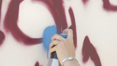 Draws graffiti paint from the container Stock Footage 114294257